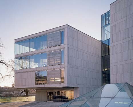 The triangular skylights describe the peculiar shape of the lower pavilion, which houses the restoration and conservation workshops, left. The front, which overlooks College Park, is a hovering translucent plane