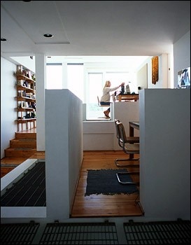 Inside, a number of skylights corresponding with a series of  openings in the floor, and no dividing walls
