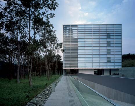 The glazed pavilion contains offices and, on the top floor, the cafeteria