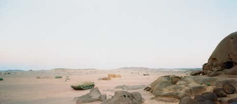 A tank guards the approach to the wall in the Sadr territories