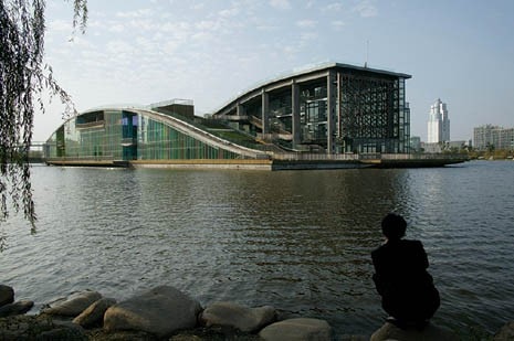 <b>Qingpu Thumb Island</b>, Shanghai, 2005. Built on a peninsula on an urban lake in Shanghai, Thumb Island combines a number of enclosed public programmes with an architectural landscape of gardens, paths and resting places