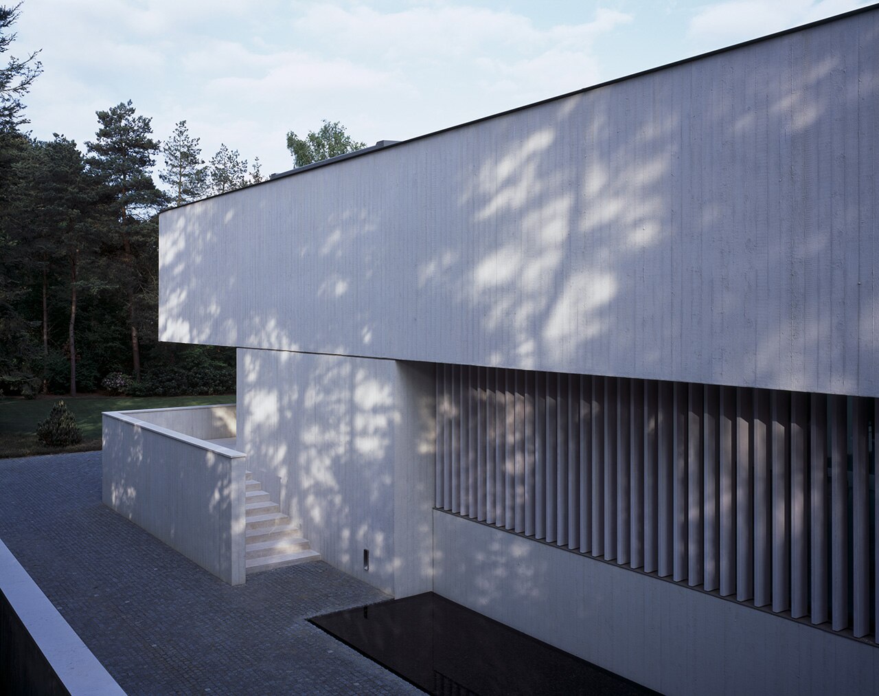 Netherlands. Russel Jones completes a sheer white concrete villa in a ...