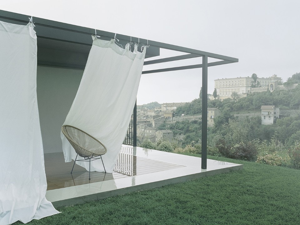 Metal frame wraps a house in the Lazio countryside