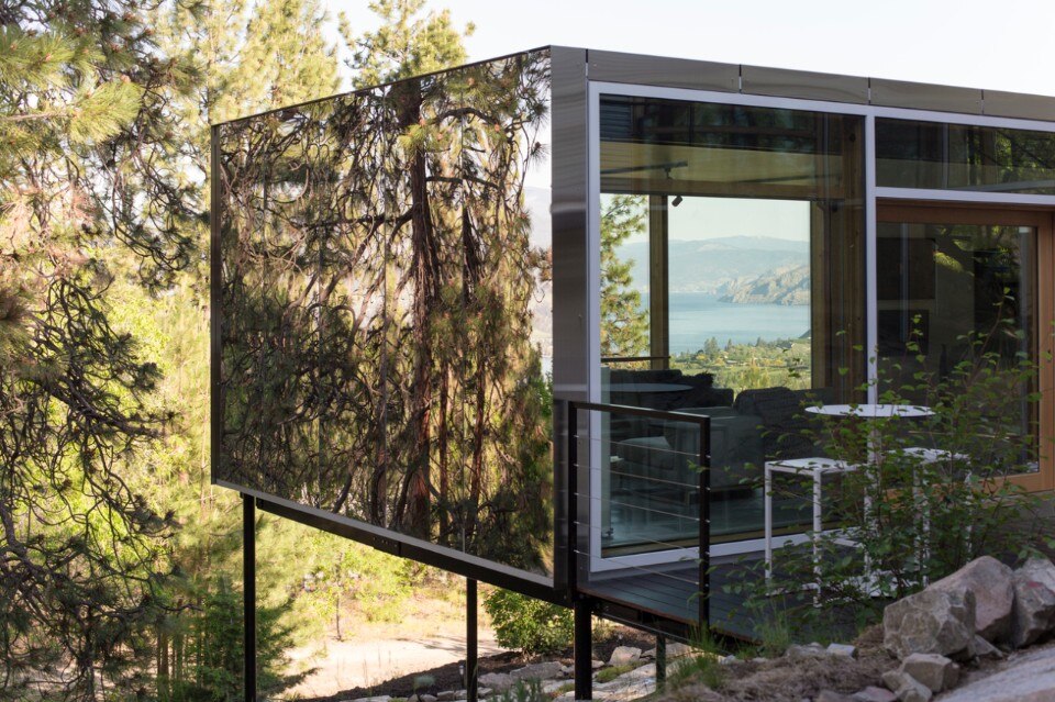 A mirroring art gallery hovering over the Canadian rocks