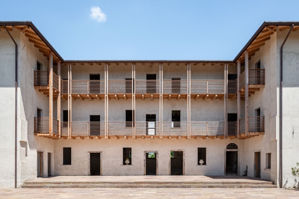 Contemporary wood and ancient bricks combine in a renovated farmhouse