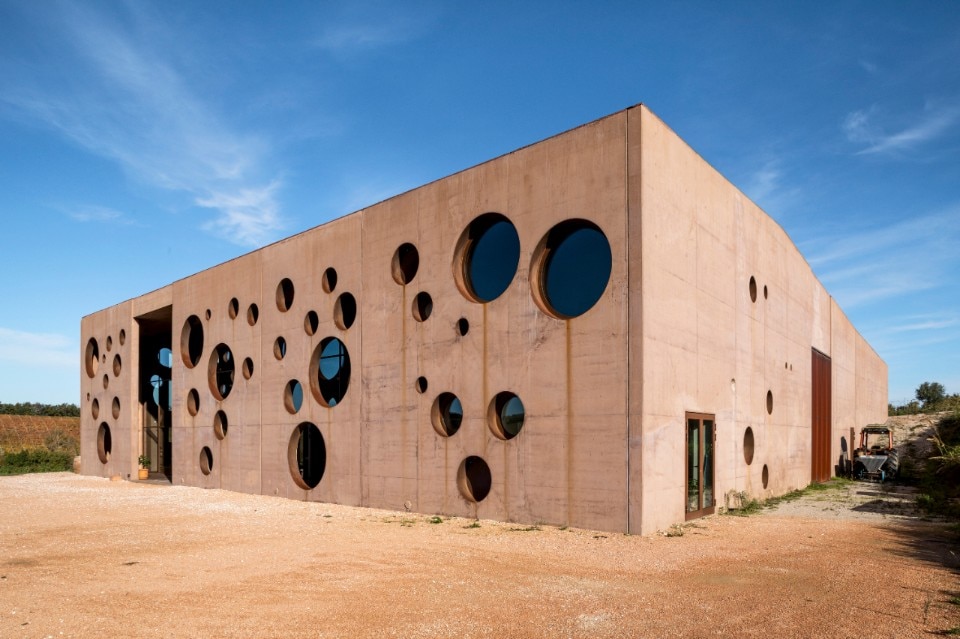 Circular holes in the facade of a Tuscan countryside winery