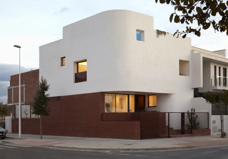 A house reveals the sharp contrast between cement and brick