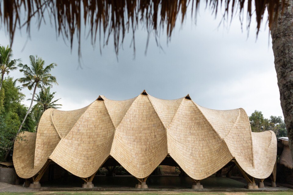 A gym under imposing bamboo arches in Bali