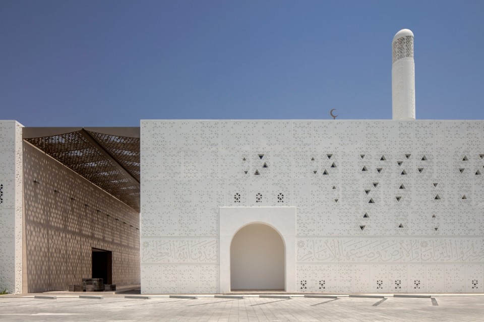 Sacred scriptures and geometries envelop a mosque in Dubai