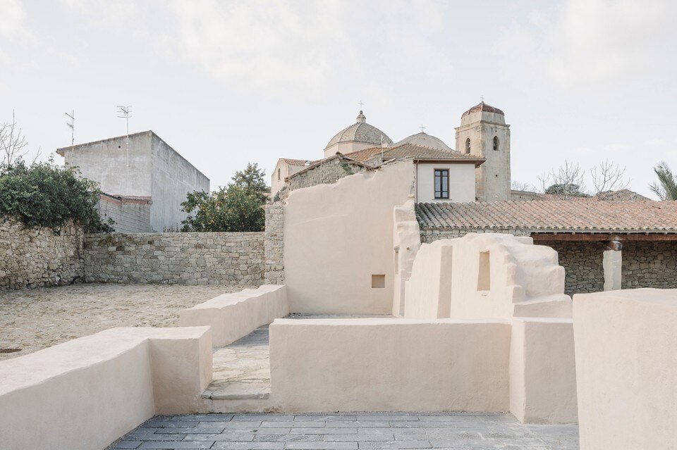 The transformation of an abandoned ruin in Sardinia, from unkept bushes to public space