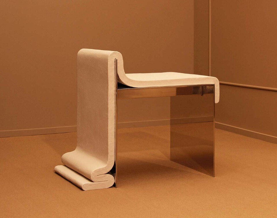 A chair makes fun of the qualities of concrete