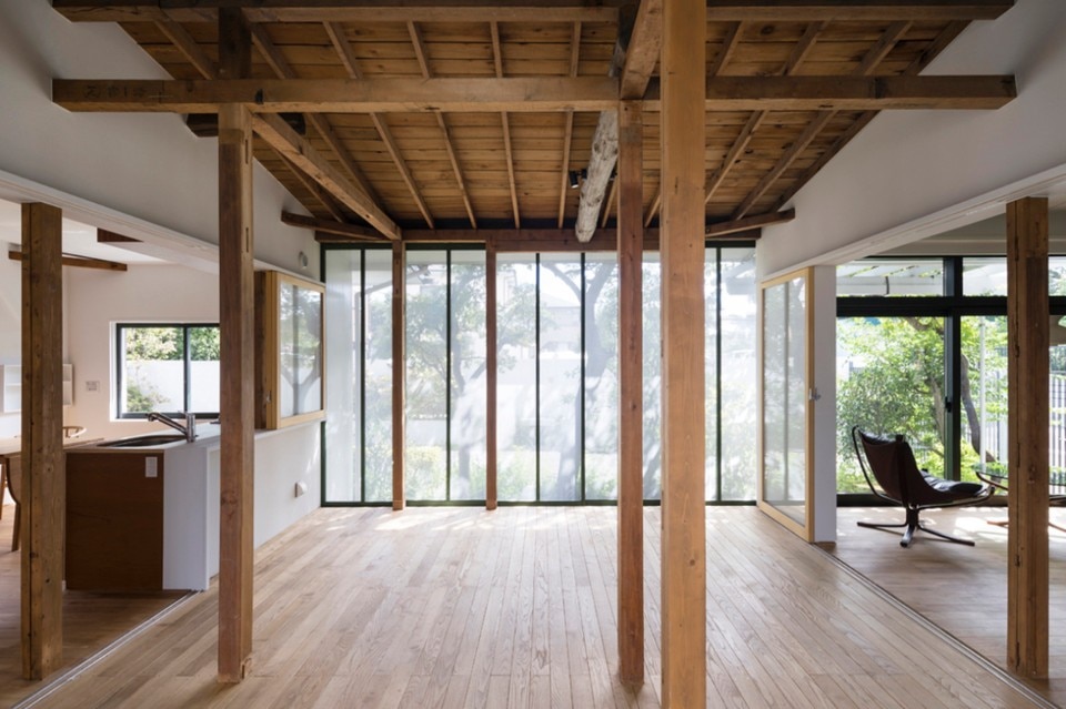 Contemporary design meets traditional wooden frames in a renovated house in Tokyo