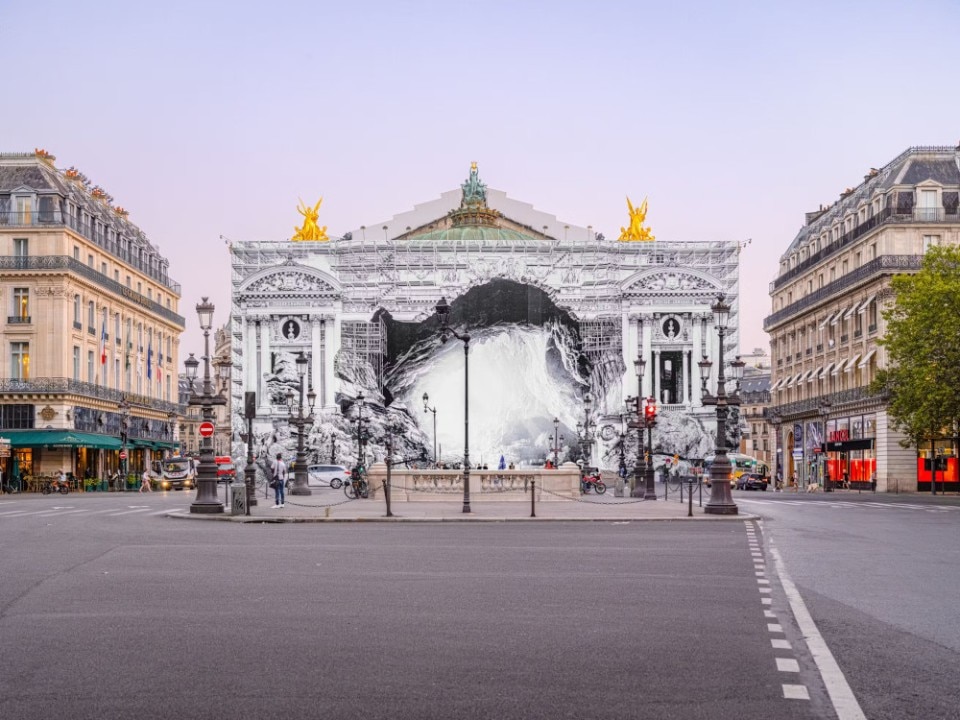 JR transforms the façade of the Paris’ Opéra into a huge cave mouth