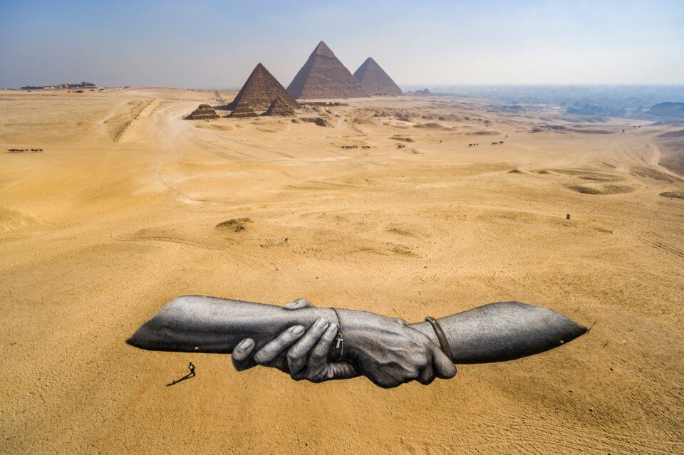 Saype’s hands have arrived at the Great Pyramids of Giza