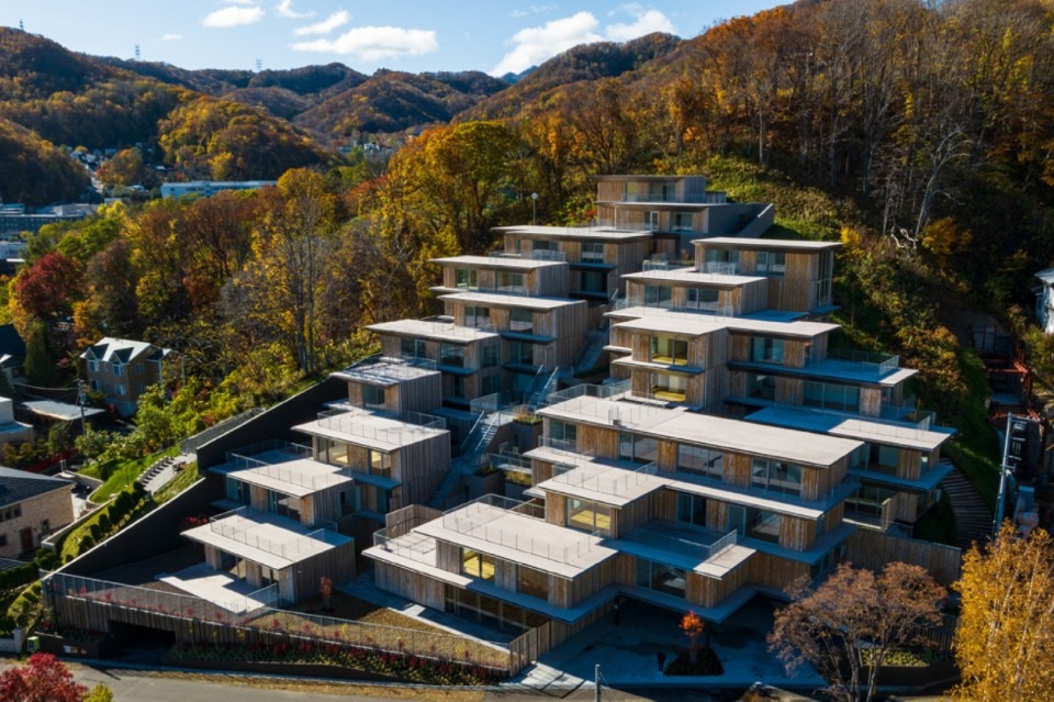 Kengo Kuma has designed a cluster of small houses on the side of a hill