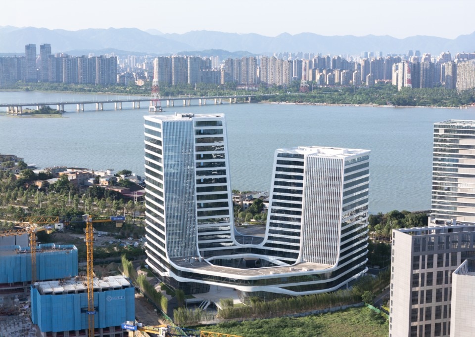 Curved towers detailed the bank of the Wulong River, China